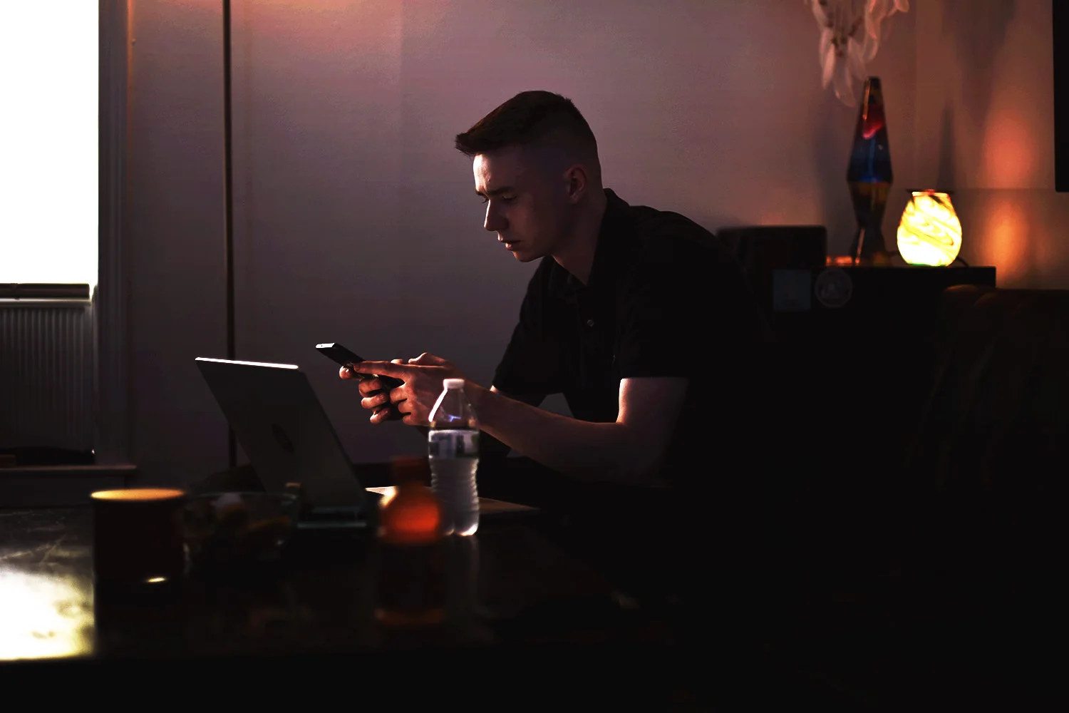 Tyler Harmon, founder of Principle Works, working at a desk